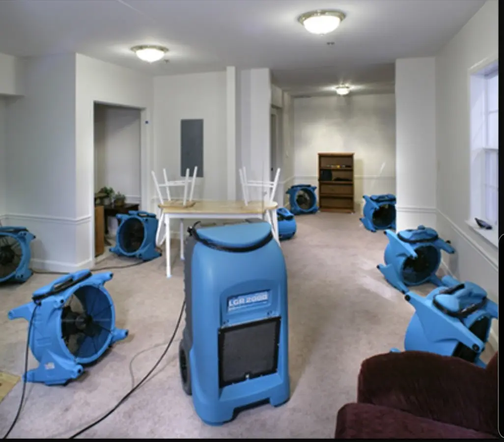 Air movers and dehumidifier setup for Water Damage Restoration in Newington